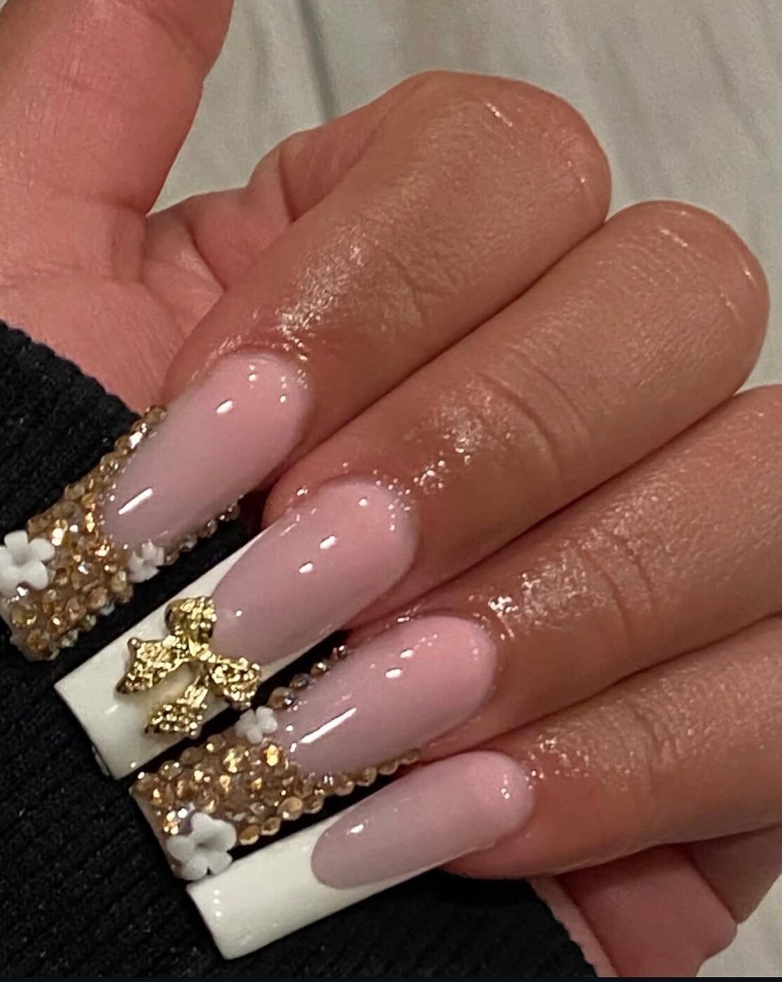 Extra long white square set with gold-crystal French, a gold bow and 3D flowers